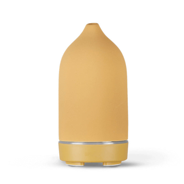 Diffuseur d'huiles essentielles en céramique Nesty - Coloris moutarde, forme galet lisse