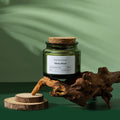 Bougie parfumée en cire de soja - Pot verre vert bouchon bois (vue 8) - Nesty