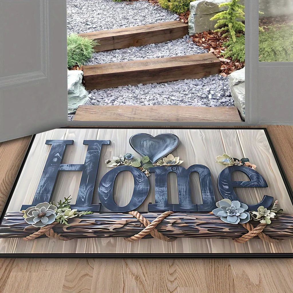 Paillasson imprimé 'Home' effet lettres bois et corde, avec cœur floral, devant une porte ouverte sur une allée de gravier - Nesty