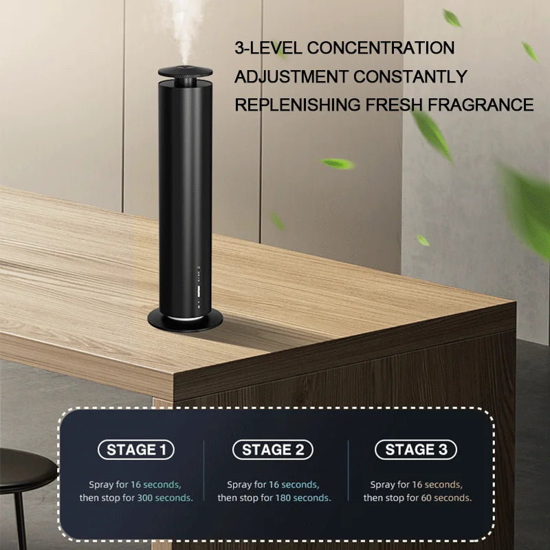Diffuseur d'arôme en métal Nesty - Colonne noire diffusant sur un bureau, réglage en trois niveaux de diffusion
