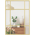 Miroir mural façon fenêtre Nesty - Cadre doré à 9 carreaux, reflet d'un lustre suspendu et d'une console avec vase et bougies