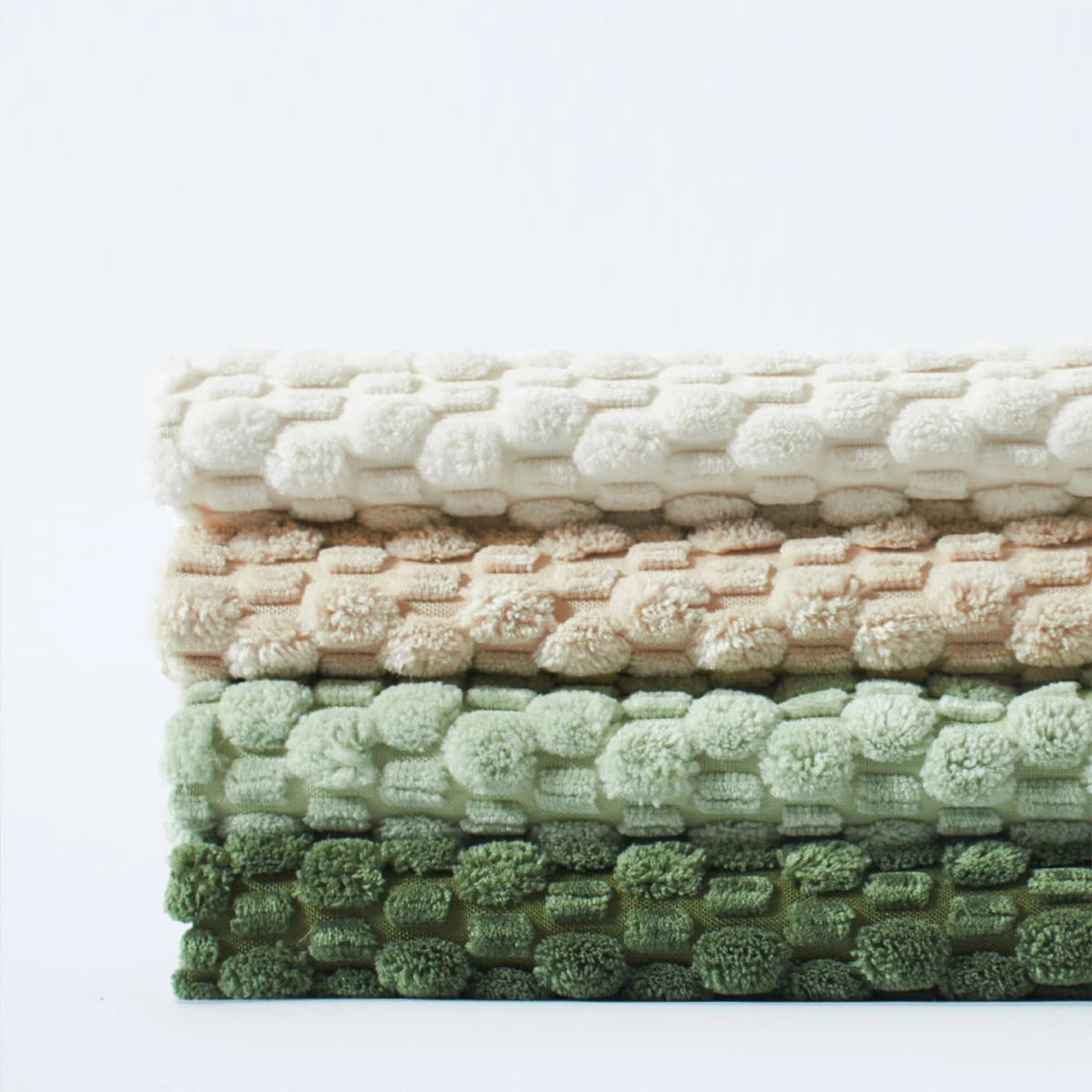 Housse de coussin réversible en velours côtelé Nesty - Empilement replié montrant le tissage