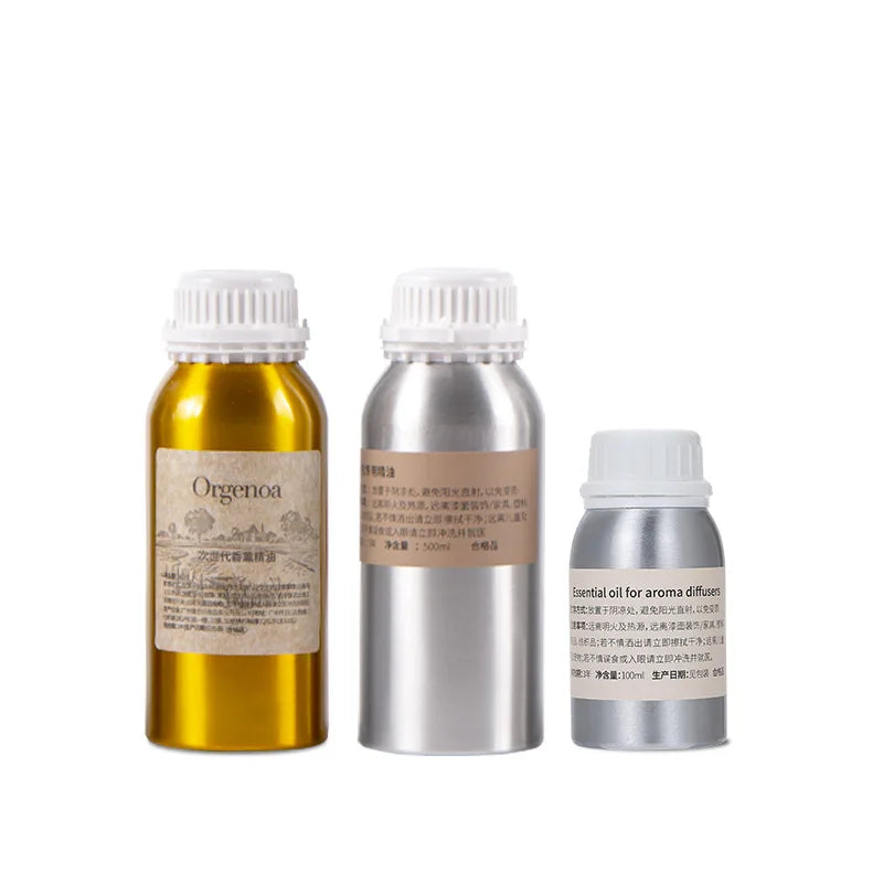 Recharge huile parfumée pour diffuseur Nesty - Trois formats de flacons dorés et argentés côte à côte sur fond blanc