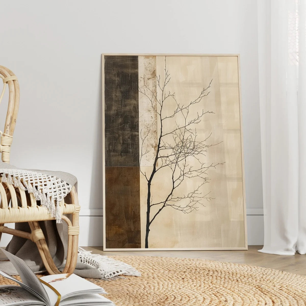 Toile imprimée arbre abstrait wabi-sabi Nesty - Affiche posée au sol contre un mur, près d'un fauteuil en rotin et d'un tapis en jute