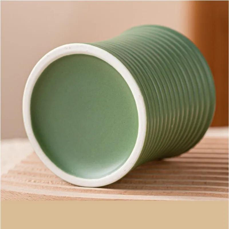 Photophore jarre en céramique striée Nesty - Modèle vert d'eau couché montrant l'intérieur blanc