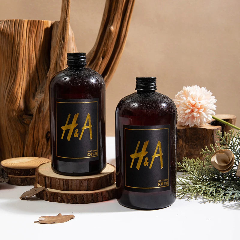 Recharge de parfum d'ambiance Nesty - Marque H&A, présentées avec bois flotté