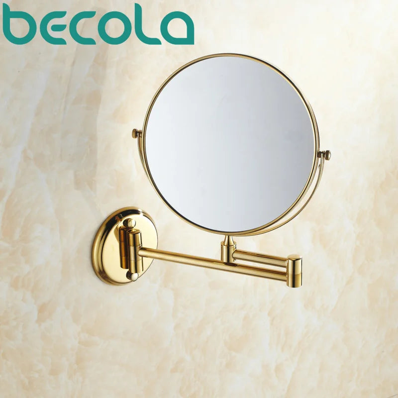 Miroir mural double face doré Nesty - Vue de face sur fond marbré, bras extensible chromé doré (marque Becola)