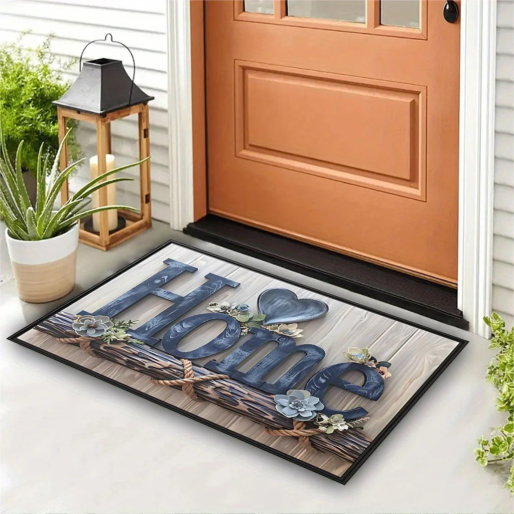 Paillasson imprimé 'Home' effet lettres bois et corde, avec cœur floral, devant une porte d'entrée orange et une lanterne - Nesty
