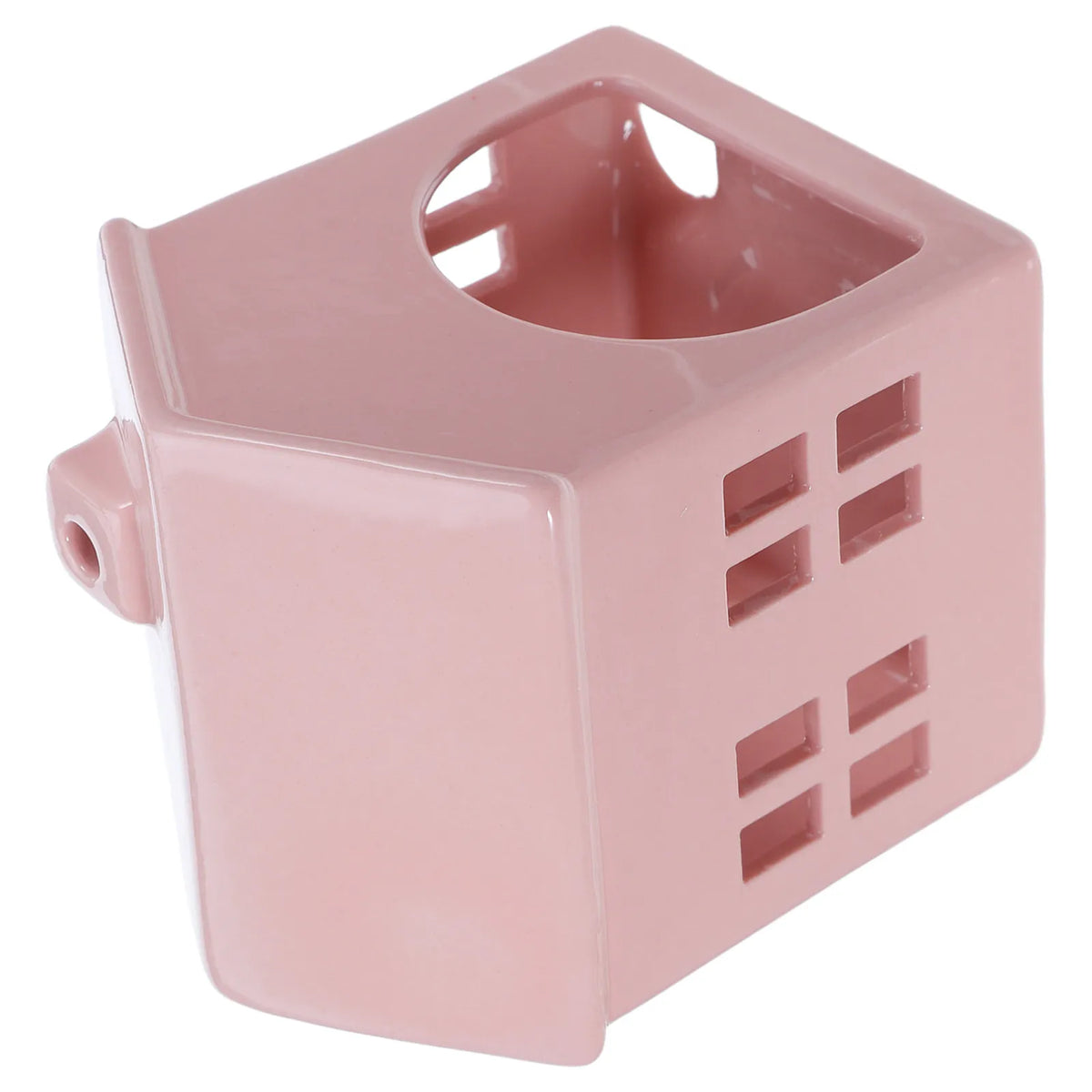 Photophore céramique rose forme maisonnette cubique, vue de biais sur les façades ajourées à motif fenêtres - Nesty