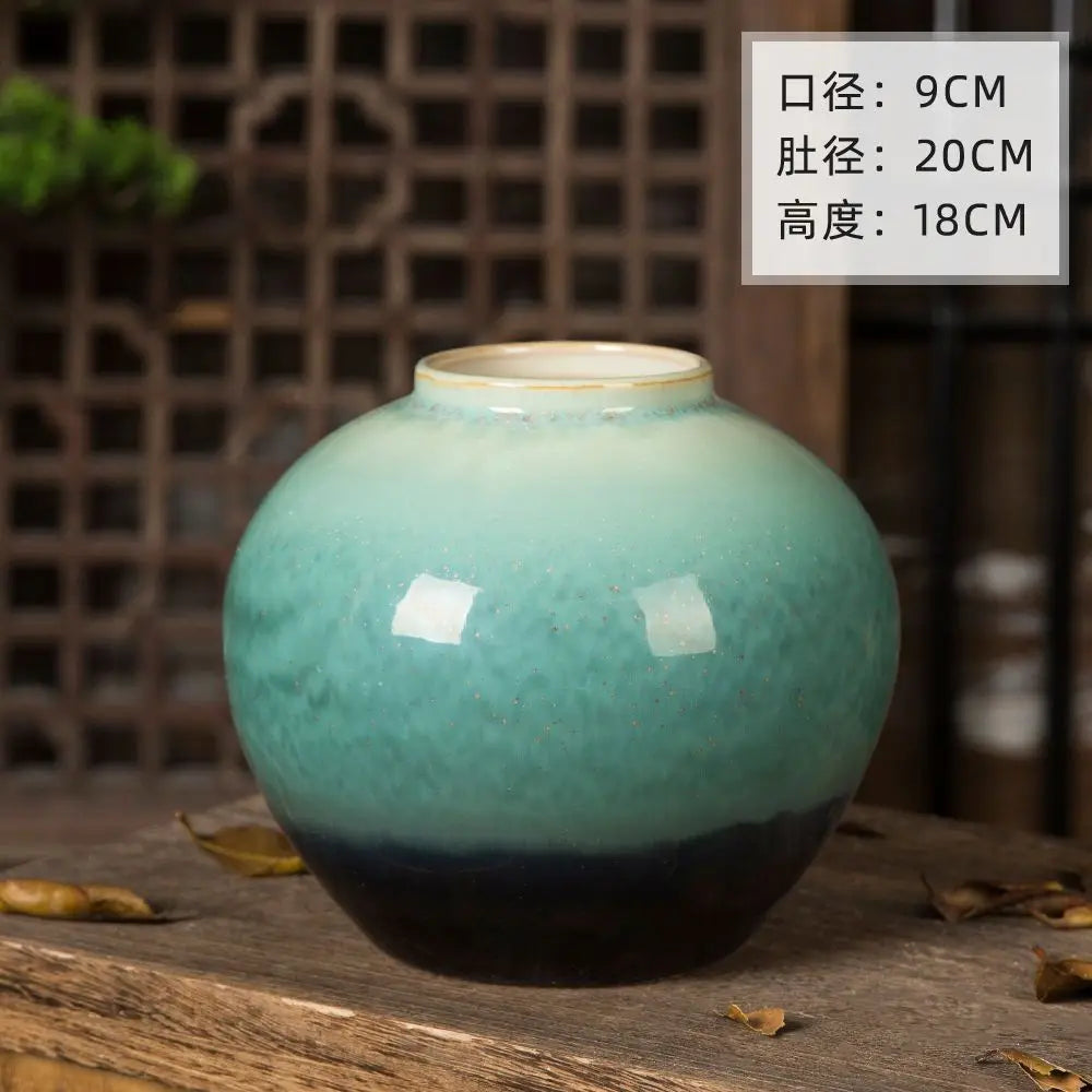 Grand vase en céramique, style rétro pour fleurs séchées Nesty, vase rond en céramique émaillée turquoise et noir seul, dimensions annotées (9cm/20cm/18cm), sur table en bois