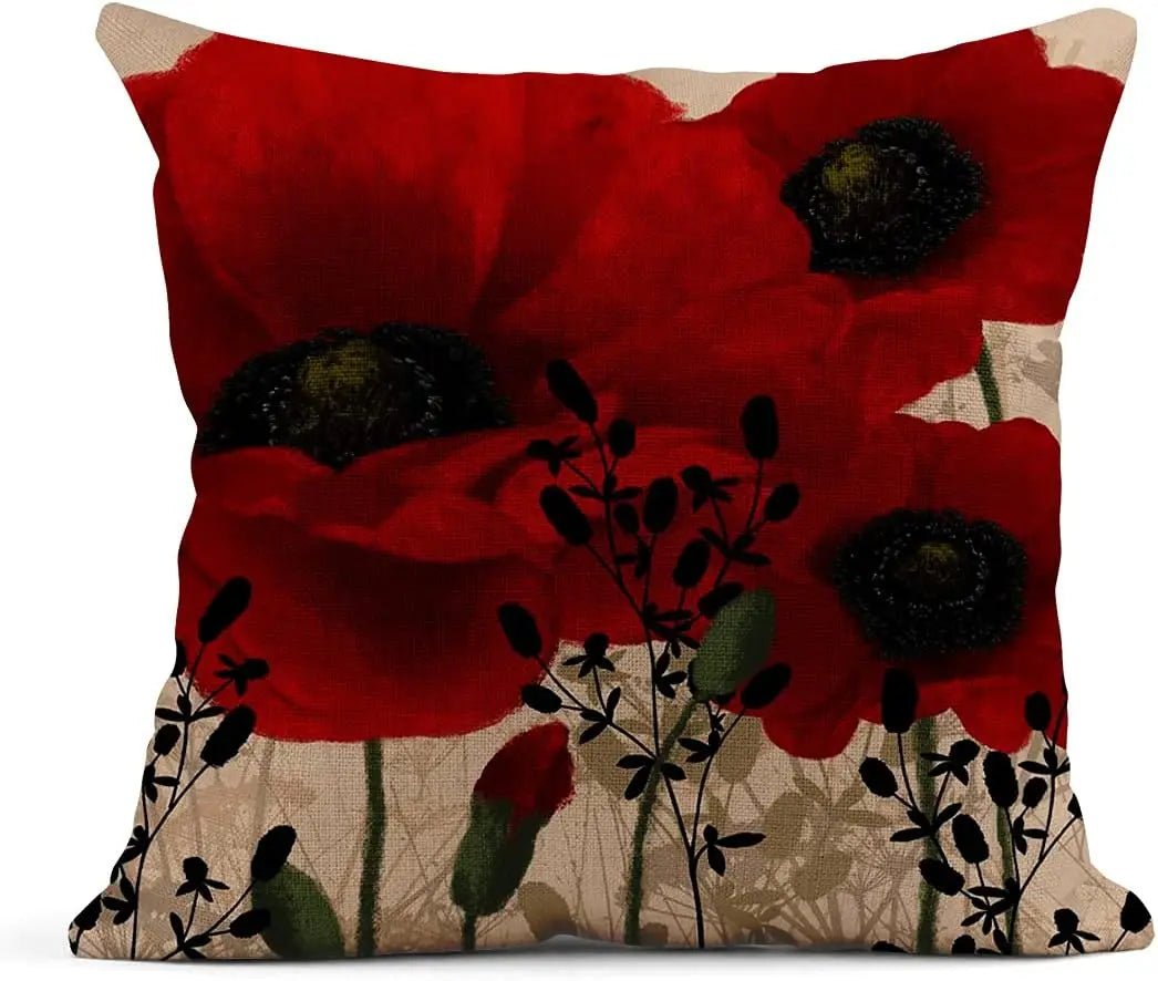 Housse de coussin en lin, motif floral rouge, format carré Nesty, housse de coussin imprimée de grands coquelicots rouges au cœur noir sur fond beige, avec silhouettes de fleurs sauvages en bas de l'image