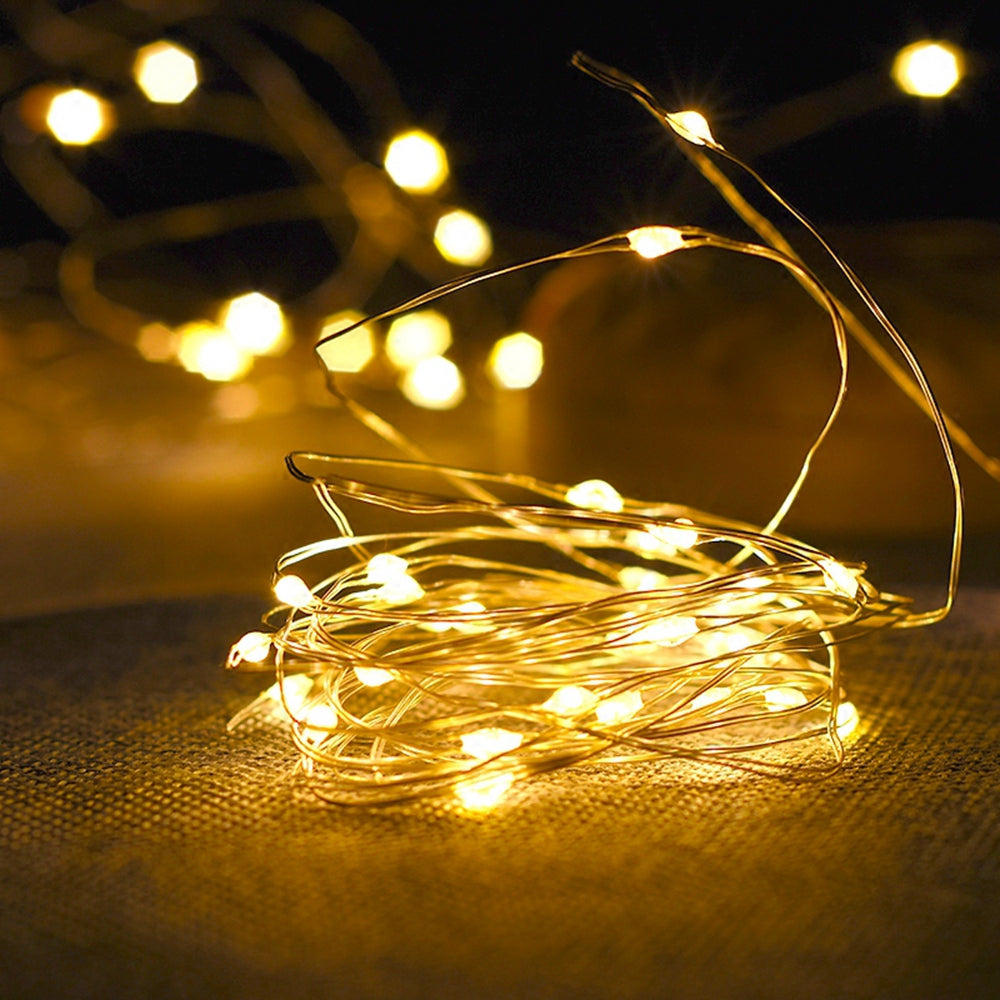 Guirlande lumineuse LED Nesty - Fil de cuivre allumé en blanc chaud sur toile de jute
